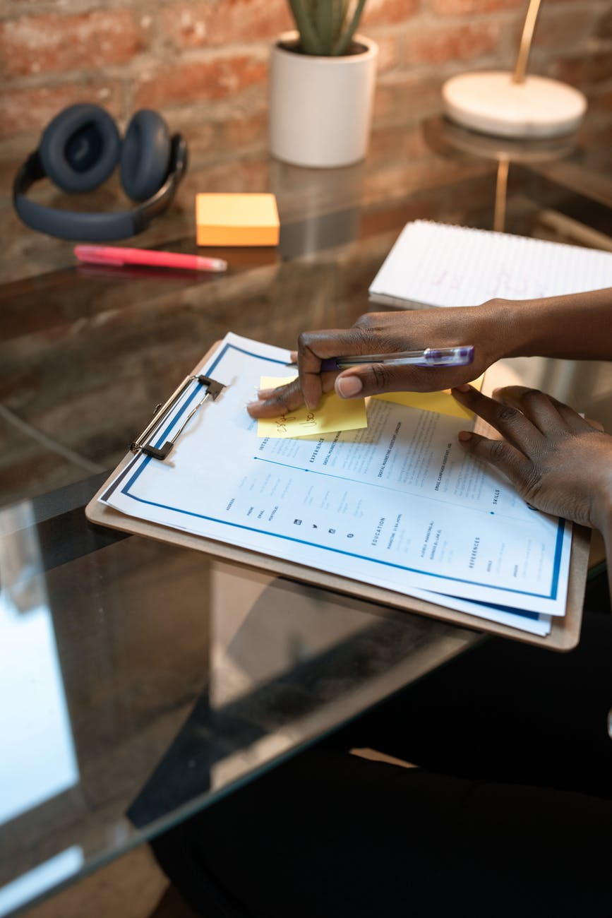 person holding brown wooden clip
